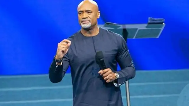 How on earth will a pastor be carrying around gun – Reactions as Paul Adefarasin publicly flashes weapon